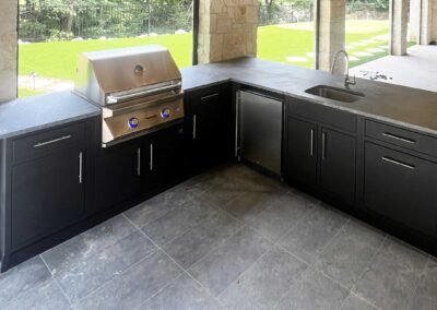 Graphite L-shape w/ Twin Eagles 30″ grill, fridge, sink, custom counters & toe kicks
