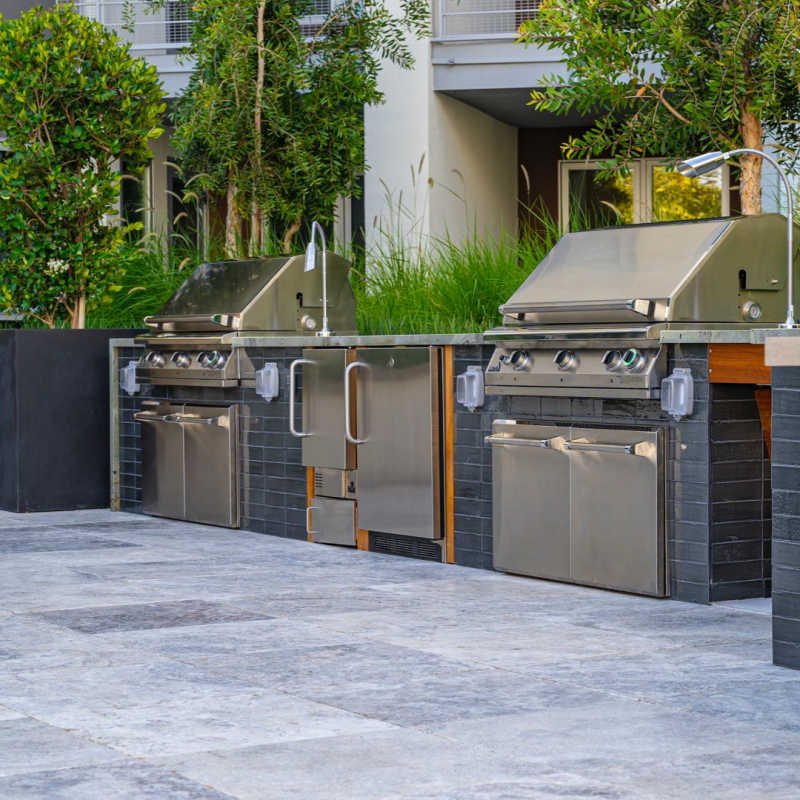 Commercial grills for apartments: two PGS T-Series units installed side-by-side at a Texas apartment complex amenity kitchen