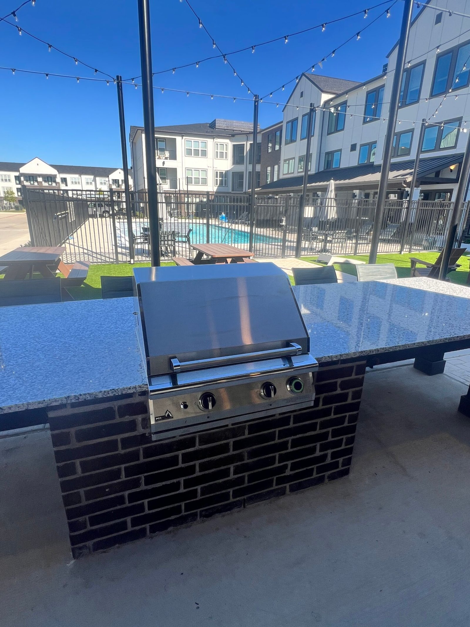 Close-up of PGS T-Series stainless steel grill on a Florida apartment community amenity deck