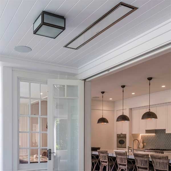 Slim Bromic Platinum electric heater recessed into a covered patio ceiling
