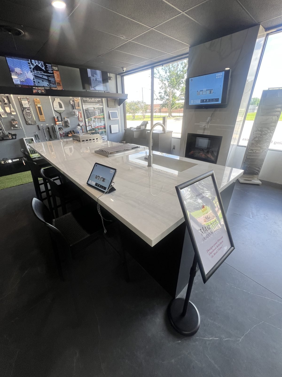 Majestic Outdoor Kitchens showroom island with countertop, sink, and real-time 3D design display in Denison, Texas